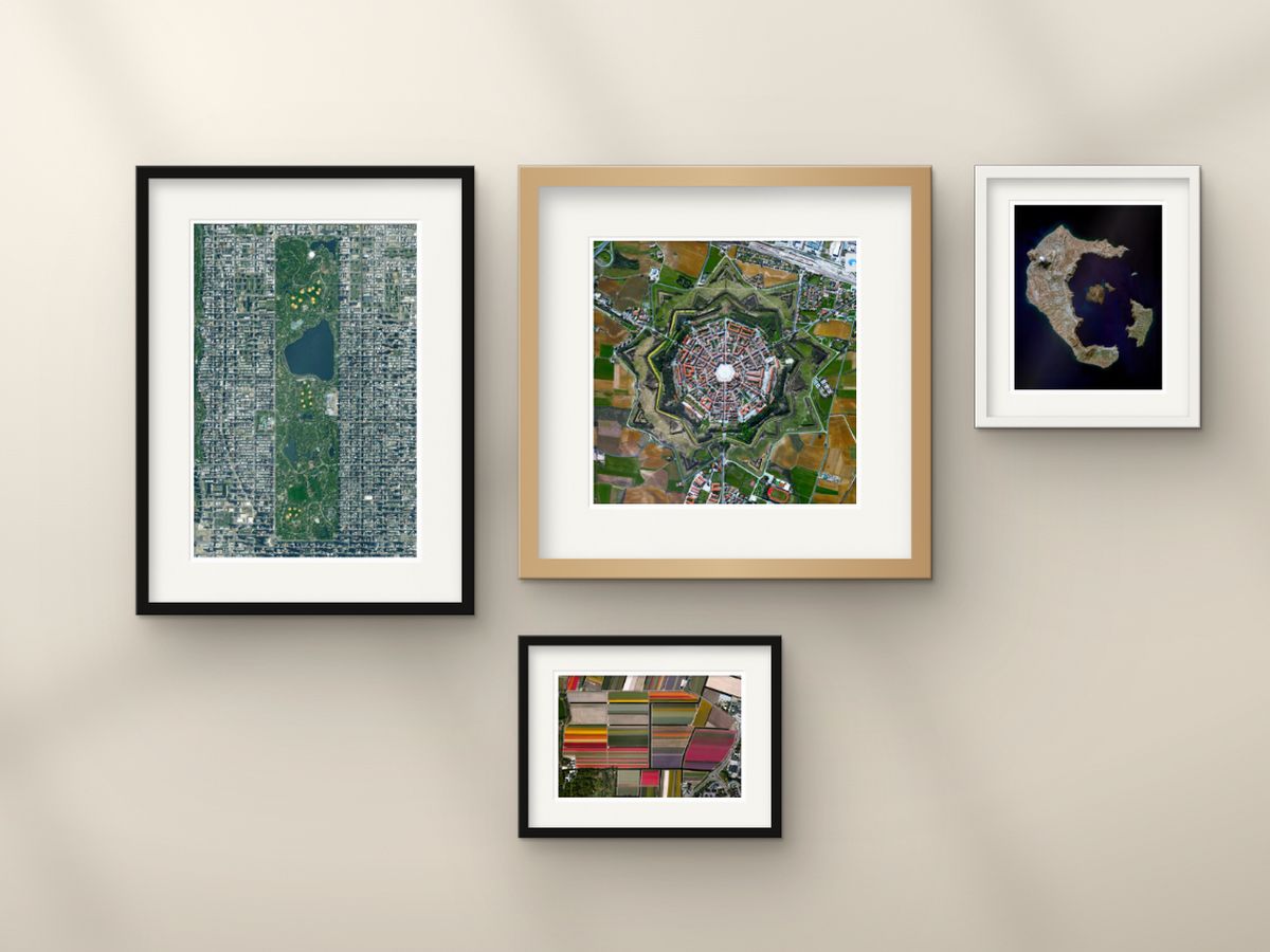 A gallery wall of framed Overview prints