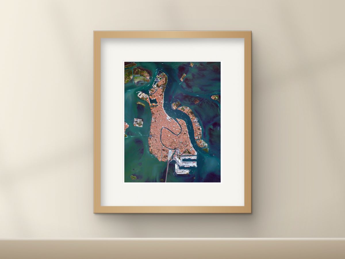 A framed Overview print of Venice on a wall